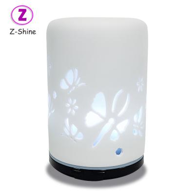 China Hotel Butterfly Engraved DiffuserMini White Ceramic Personal Portable Commercial Ultrasonic Aroma Humidifier for sale