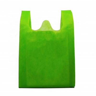 China Eco - Friendly Promotional Foldable Non Woven Supermarket T Shirt Bag Reusable Shopping W Cut Out Non Woven Vest Bag for sale