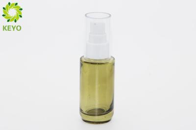 China 30ml Green Glass Foundation Bottle Round Shape With White Plastic Pump Cap for sale