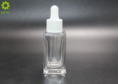 China 1oz Luxurious 30ml Glass Dropper Bottles With Matte White Dropper Cap for sale