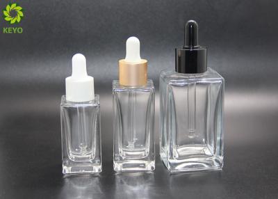 China Luxury Cosmetic Essential Oil Bottles 30ml 50ml 120ml Flat Shoulder Square Glass Clear Dropper Serum Bottle for sale