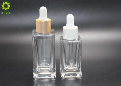 China Empty Cosmetic 30ml 50ml Luxury Flat Shoulder Square Clear Glass Essential Oil Dropper Bottle for sale