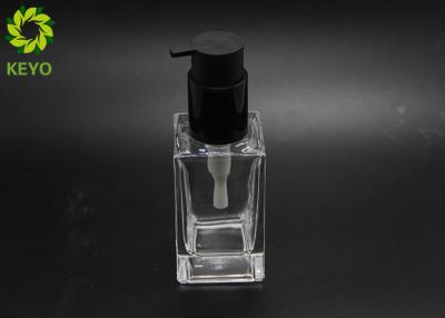 China 100ml Square Glass Cosmetic Containers With Self Lock Pump for sale