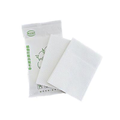 China Square Disposable Grain Embossed White Facial Cleansing Disposable Face Towel For Facial Massage for sale