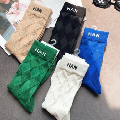 China 2022 Spring And Summer Double C Solid Color Leisure Sports Hot Stamping High Quality Socks Antibacterial Medium Handmade Leather Tube Label for sale