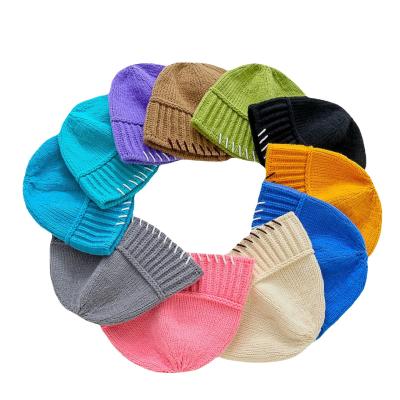 China Winter COMMON Cheap Fashion Promotional Custom Woven Patch Knitted Beanie Hat for sale