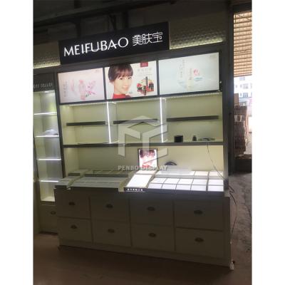 China Modern professional wholesale custom interior design small wooden cosmetic shop cosmetic display cabinets for sale