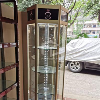 China Modern Newcomers Metal Jewelry Showcase Glass Cabinet Light Rotating Store Rack Display Decoration Design for sale