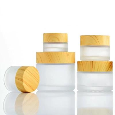 China Frosted bamboo cosmetic glass bottle lotion pump bottle and cover and spray pump jar cosmetics packaging for sale