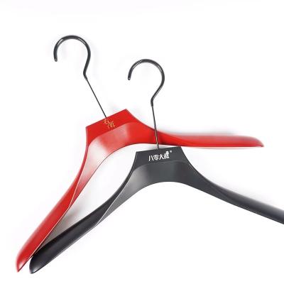 China New fashion casual hot sale custom made luxury black cloth hanger plastic hanger for shops with custom logo for sale