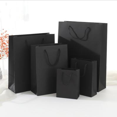 China Recyclable Black Custom Card Paper Bag Clothing Shopping Bag Gift Packaging Handbag With Custom Logo for sale