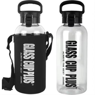 China 1000ml Glass Water Bottle With Silicone Sleeve And Leakproof Lid for sale