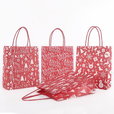 China Exquisite Xmas Paper Stain Christmas Paper Bag Christmas Series Packing Red Paper Bag Wholesale Paper Bag for sale