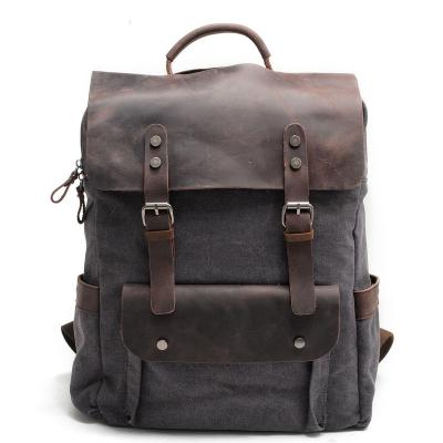 China Vintage Design Cotton Canvas Waterproof Stylish European Leather Cover Large Capacity School Laptop Backpack Unisex Bag for sale