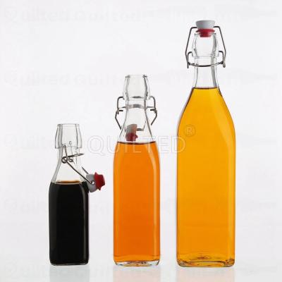 China Beverage 250ml Clear 500ml 1000ml Square Flat Bottom Swing Top Lid Beverage Beer Glass Wine Bottle With Caps for sale