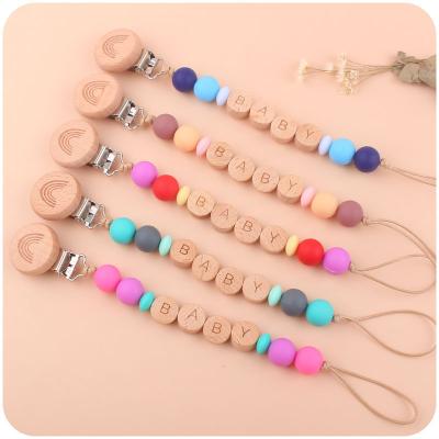 China BPA Free Rainbow Wood Beaded Pacifier Clip Dummy Nipple Chain Holder for Infant Soother for sale