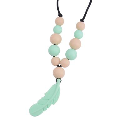 China Daily life factory direct sale feather stick silicone necklace mother wear pendant molar grind for sale