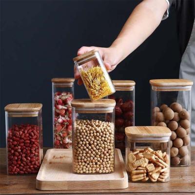 China Modern Design Food Storage Container with Bamboo Wood Lid 300ml 500ml Spice Glass Jar for sale