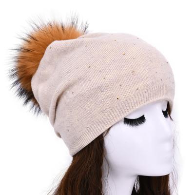 China Factory Wholesale COMMON Wool Knitted Beanie With Real Raccoon Fur Pom Pom Ball Winter Hats For Ladies for sale