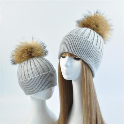 China MOM AND BABY COMMON Hat With Real Raccoon Fur Pom Pom Wool Knitted Parent-Child Hat Women Fur Hat Winter for sale