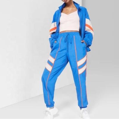 China Wholesale Bulk Blue Winter QUICK DRY Striped Nylon Anorak Two Piece Tracksuits Women for sale