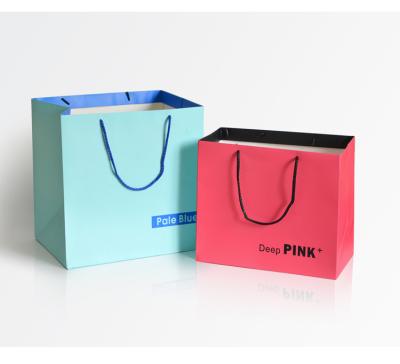 China New Arrival Luxury Bags Recyclable Logo Shopping Cardboard Paper Bag Custom Made In Stock High Quality Paper Bag With Rope Handle for sale