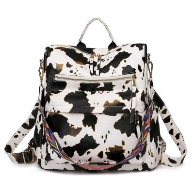 China Wholesale Waterproof Monogrammed Cow Leather Backpack With Colorful Strap Hot Sale PU Cow Backpack for sale