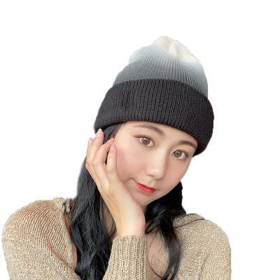 China Trendy New Product Striped Tie Dye Gradient Knit Cap Embroidery Custom Logo for sale