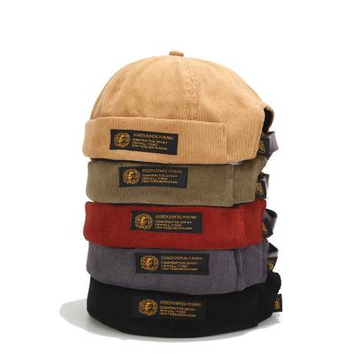 China 2021 High Quality Striped Corduroy Leather Buckle Hat Cotton Bowler Beanie Hat New for sale