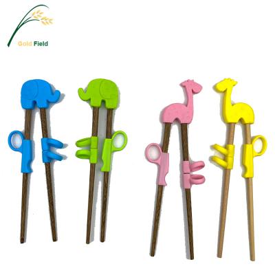 China High Quality Viable Kids Tableware Kids Forming Wooden Chopsticks Chop Stick With Silicone Cartoon Tool for sale