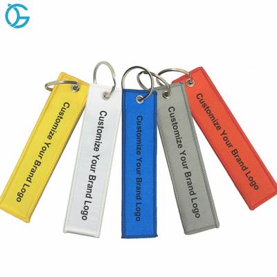 China Wholesale Customized Flight Logo Name Woven Luggage Tag Label Embroidery Keyring Keychains From Europe Factory for sale