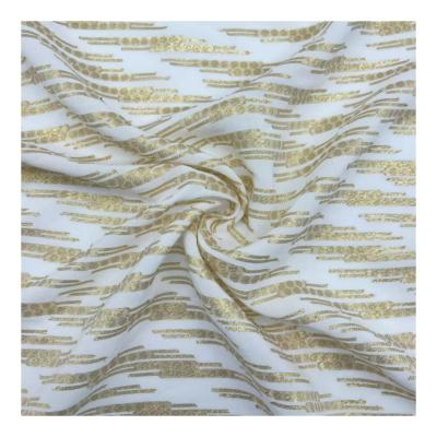 China Wrinkle Resistant Fancy dress Fabric Rayon Viscose Metal Free sample Jacquard gold cut flower chiffon Fabric for sale