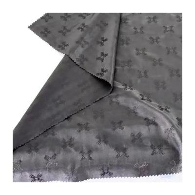 China Shrink-Resistant High quality 50D polyester filament yarn 75D semi dull  black jacquard fabric polyester lining fabric for jacket coat for sale