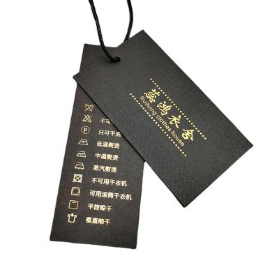 China Custom Cheap Label Paper Apparel Label Wrapping Matte Black Gold Foil Logo Gift Hang Tag With Rope for sale