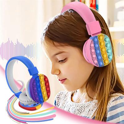 China Cute Headband Kids 3d Pop Up Bubble Push Up Pop Up Wireless Stereo Headsets Silicone Stirring Person Unicorn Pop Up Earphone For Adults for sale