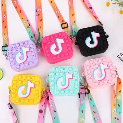 China Reusable trend kids rainbow tik tok pop it wiggle bag coin purse girl silicone jelly rainbow tiktok pop it wiggle purses and the handbag for sale