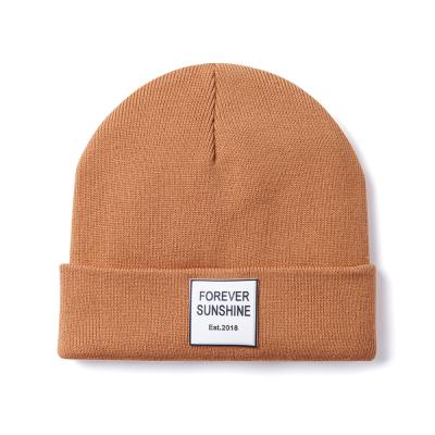 China New Winter JOINT Hat Custom Leather Patch Knit Acrylic Beanie Cap 100% Blank Beanie Hats for sale