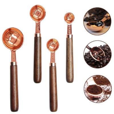 China Sustainable Rose Gold Plated Stainless Steel Dosers Set Of 4 Pieces Coffee Scoop With Wooden Handle for sale