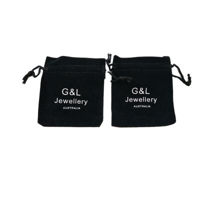 China Recyclable Custom Black Velvet Drawstring Jewelry Pouch Bag With White Logo for sale