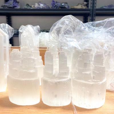 China Europe Natural Hand Carved Gypsum White Iceberg Crystal Candle Jar Ore Crystal Opens Double Selenite Lamp for sale