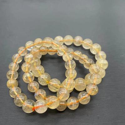 China Other Hot Selling Cheap Natural Gold Hair Crystal Round Beads Rutilated Quartz Bracelet for sale