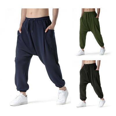 China New Trend Hip Hop Performance QUICK DRY Harem Pants Men's Big Pockets Loose Pants for sale