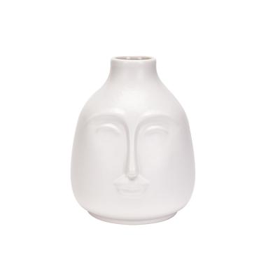 China Human face statue good selling simple modern ceramic living room TV cabinet decoration vase white porcelain dried flower flower arrangement for sale