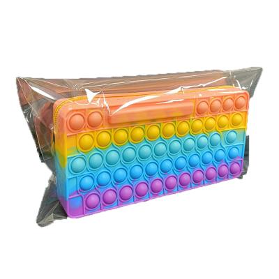 China Schools & Hot sale keyboard popit pencil case pen and pencil storage bags for girls and boys pop up bubble pencil case silicone with zipper for sale