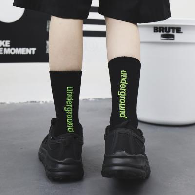 China Trendy Pattern Sporty Fashion Letter Cotton Sports Socks For Men And Women for sale