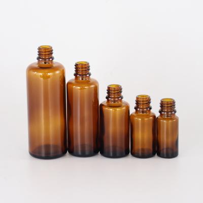 China Amber Boston Round Glass Bottles Refillable Empty Spray Atomizer For Essential Oils Amber Glass Dropper Bottle for sale