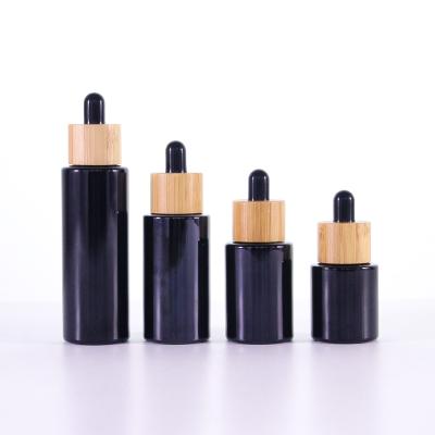 China Refillable Ready to Ship Black Opaque Black Cosmetic Packaging Lotion Glass Bottle, Empty Cosmetic Glass Dropper Bottle for sale