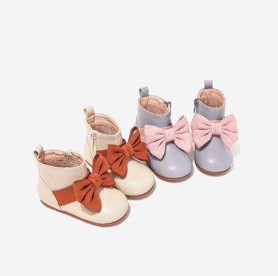 China Baby Small Round Ankle Soft Leather Boots For Girl Purple Bowknot Shoes Slip Winter Short Plush Baby Kid Warm Boot for sale