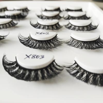 China 25-30 Periods Wholesale Imitated Mink False Eyelashes 3d Thick Cross Eye Lash Lashes Natural Black Curly Super Curling Lashes for sale