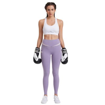 China New breathable leisure fitness women's yoga suit set European and American fashion beautiful back bra tights two sets for sale